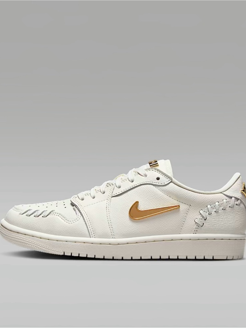 Nike Low-Top Sneaker in White with Gold Swoosh Accent